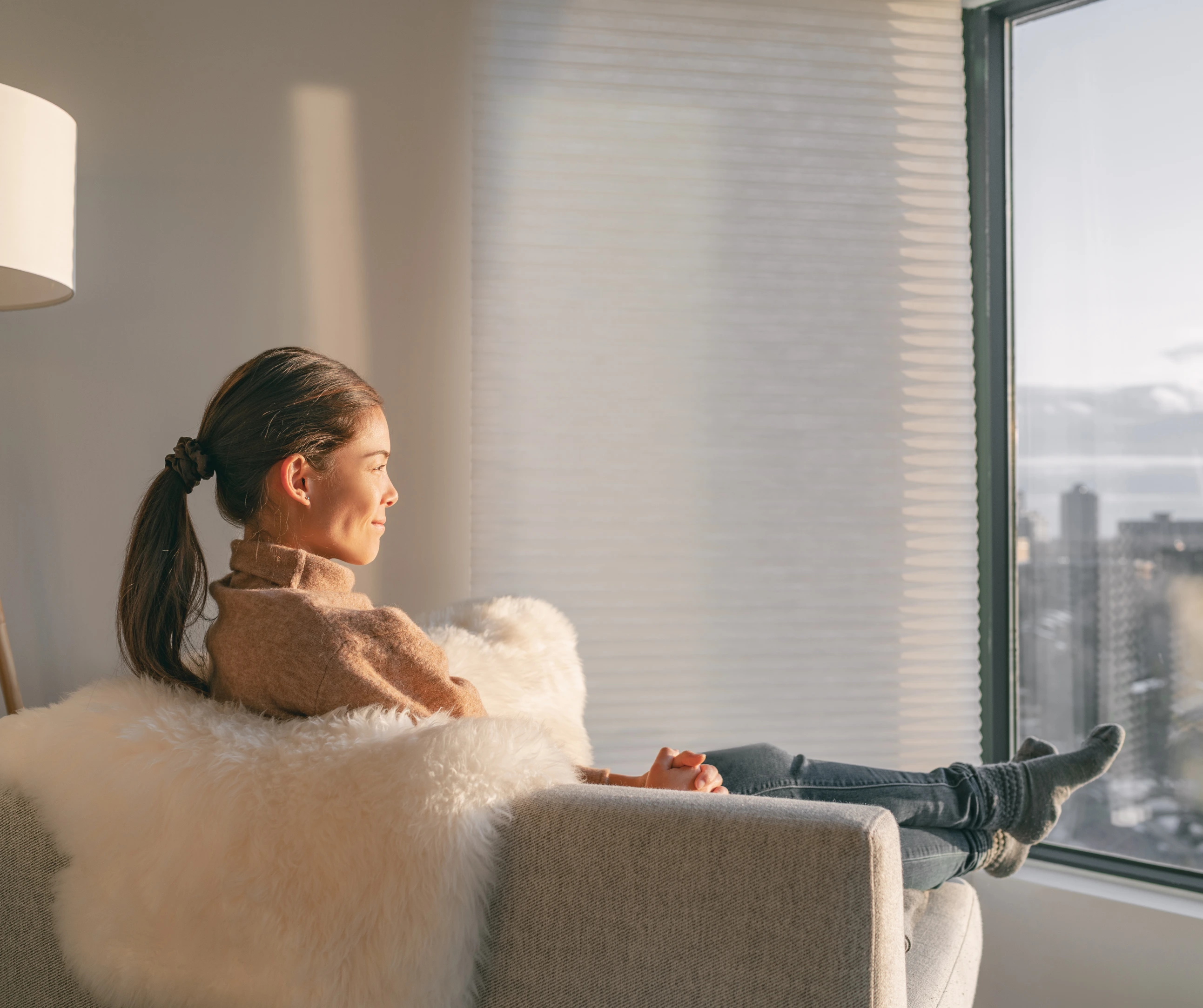 A person looking thoughtfully out of a window lifebalance wellbeing growth